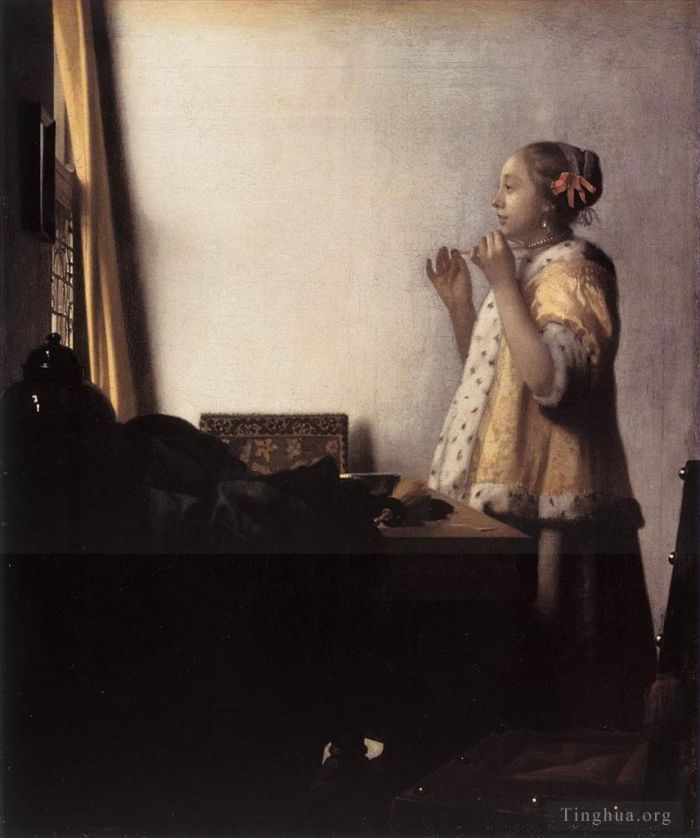 扬·弗美尔 的油画作品 -  《戴珍珠项链的女人》